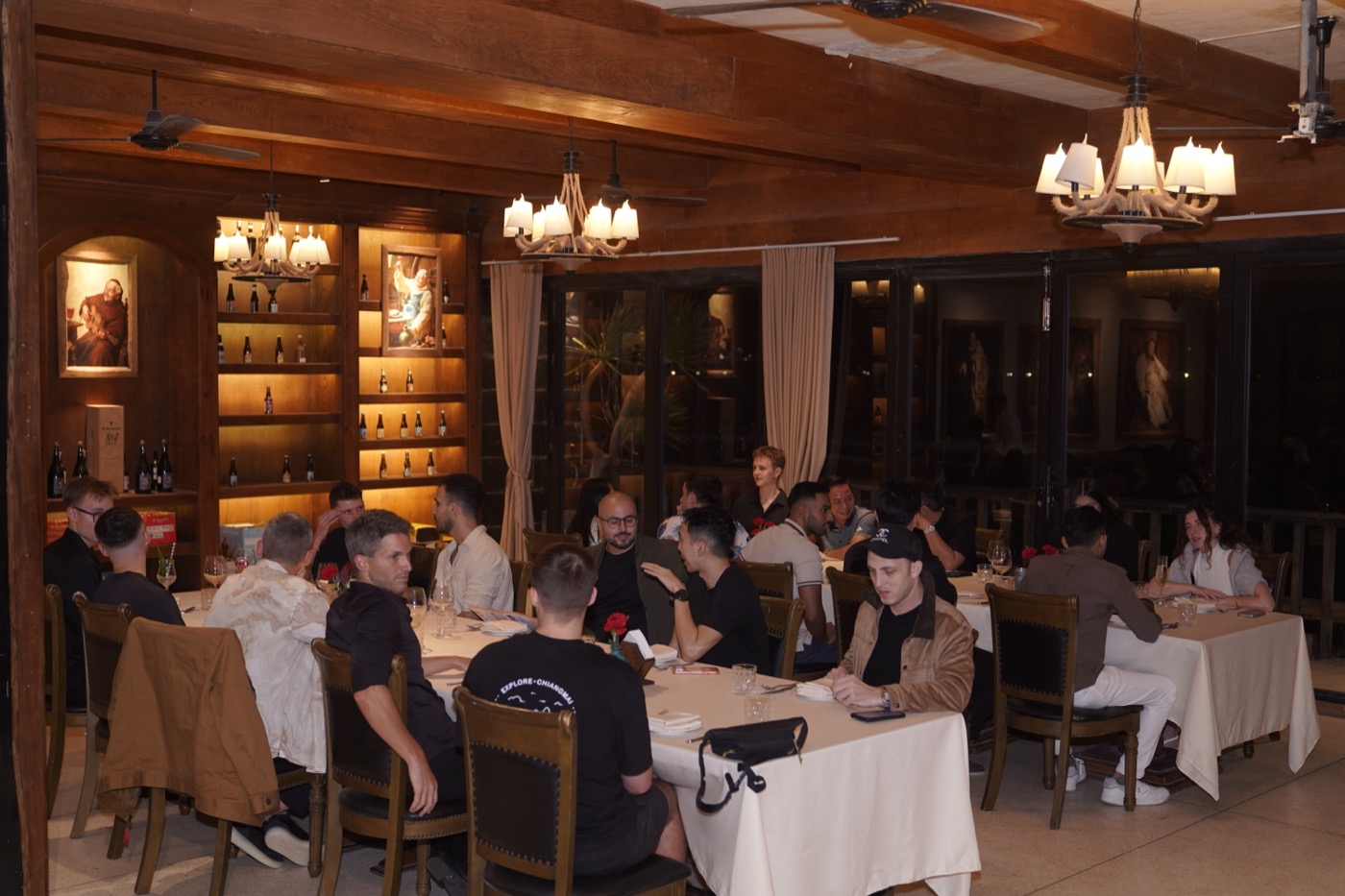 Guests seated at the long dinner table