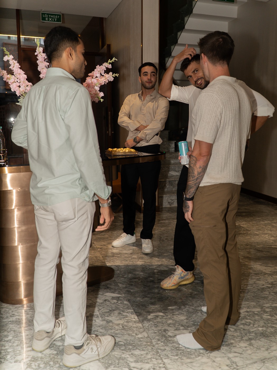 Founders talking by the entrance